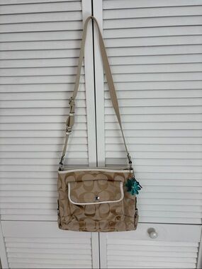 Coach Beige Signature Canvas File Crossbody Bag with Teal Flower Charm